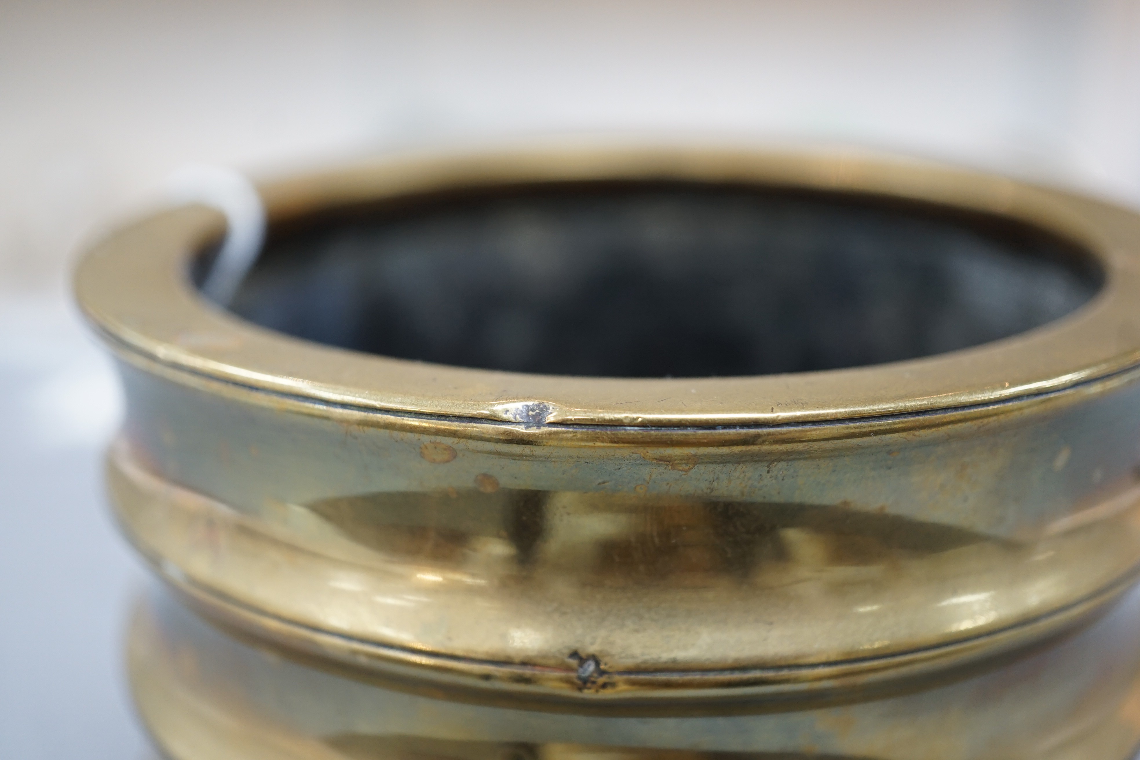 A Chinese bronze censer, two character Xuande seal mark, 18th century, 10.4cm high, 12.1cm diameter, small dents